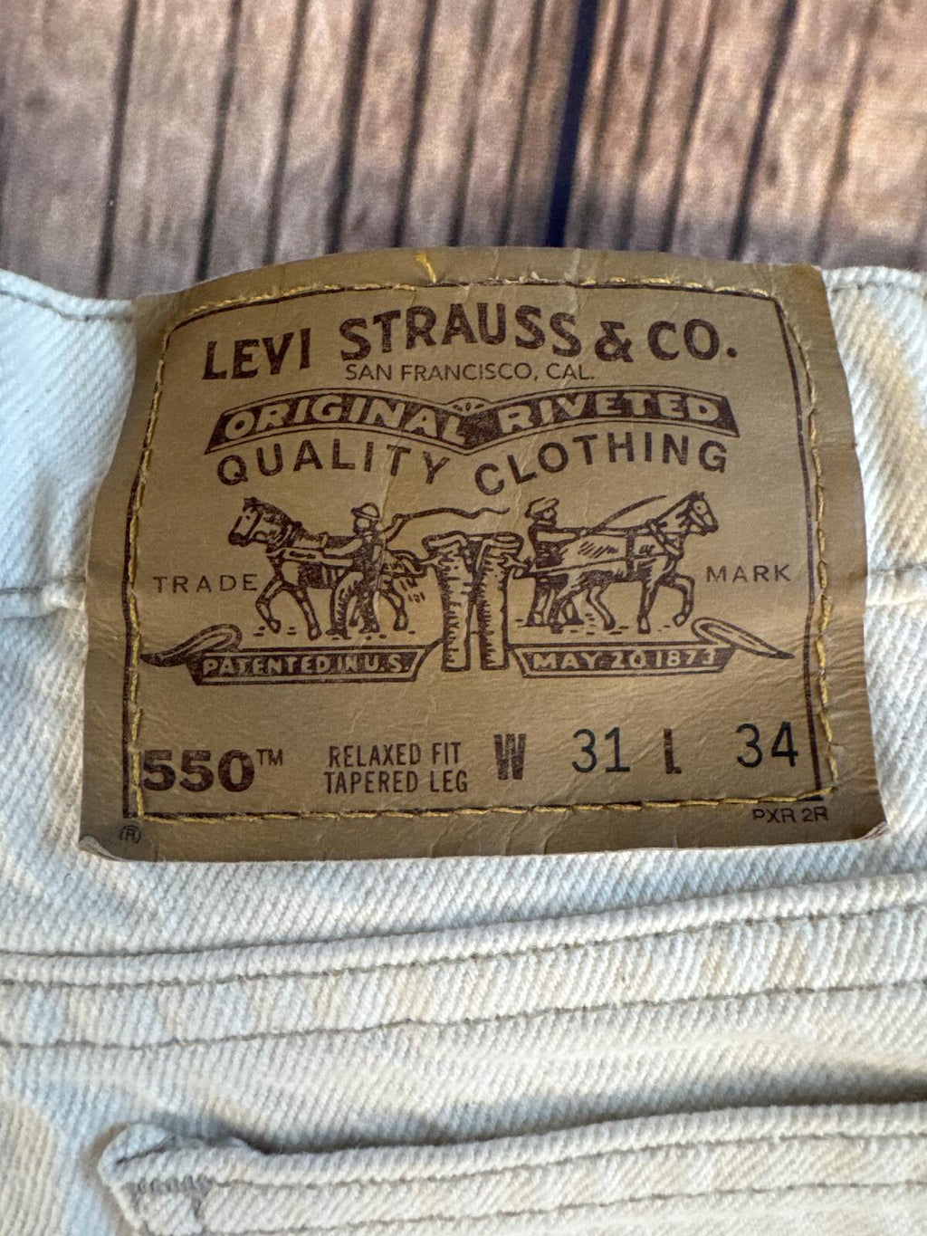 Vintage Levi’s 550 Orange Tab Made USA Cream Jeans 31x34